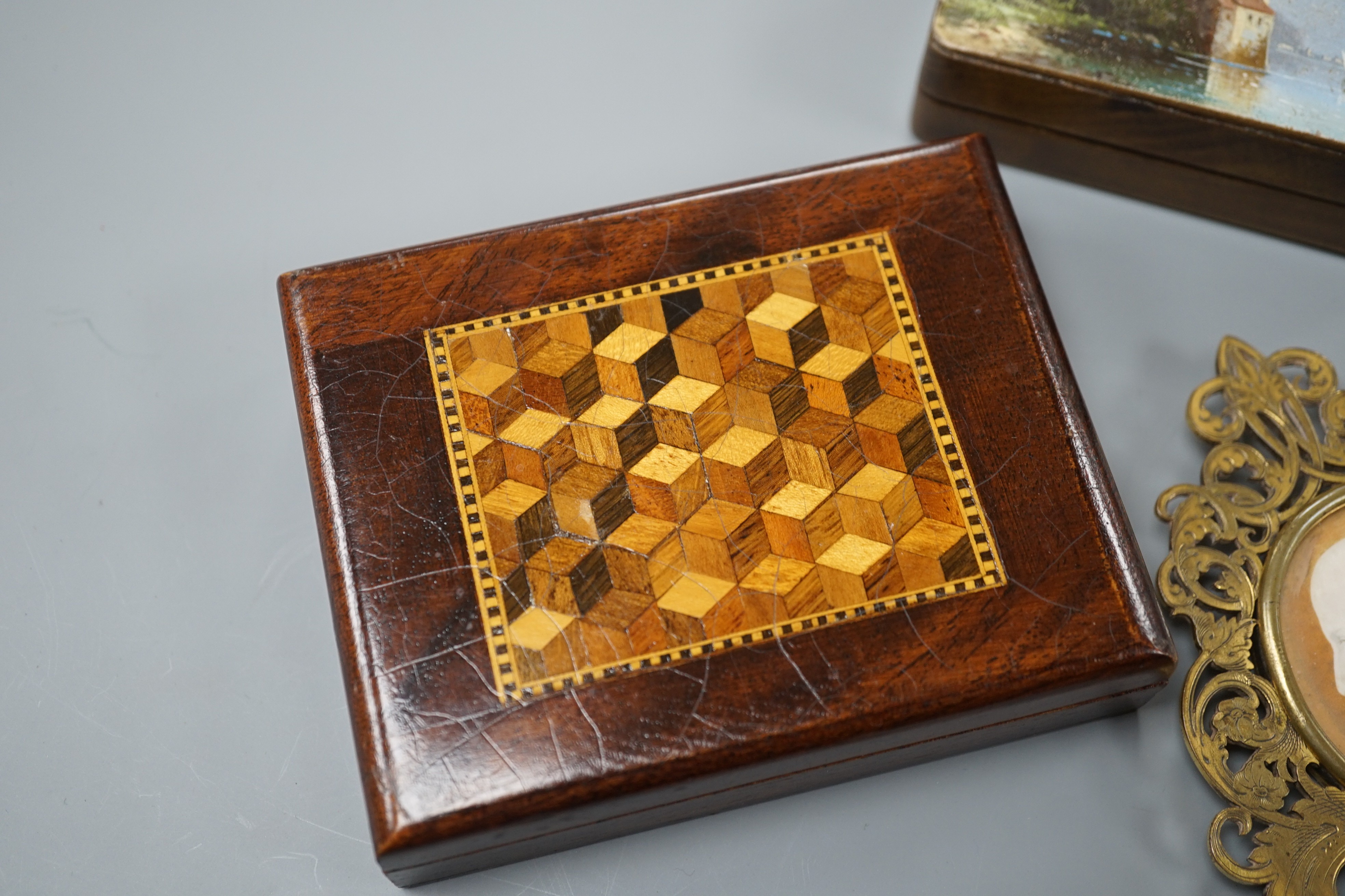 A mid 19th century portrait miniature on ivory in a gilt brass frame, a Tunbridge ware playing card box, 10.7cm and a Swiss painted wood stamp box (3)